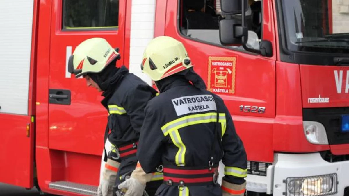 Firefighters put out a fire in an auxiliary building in Gomilica